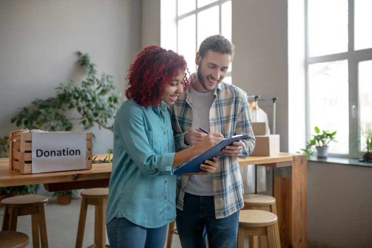 Young man and girl in the office working.